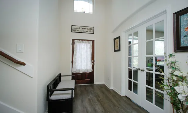 hallway with wooden floor and stairs