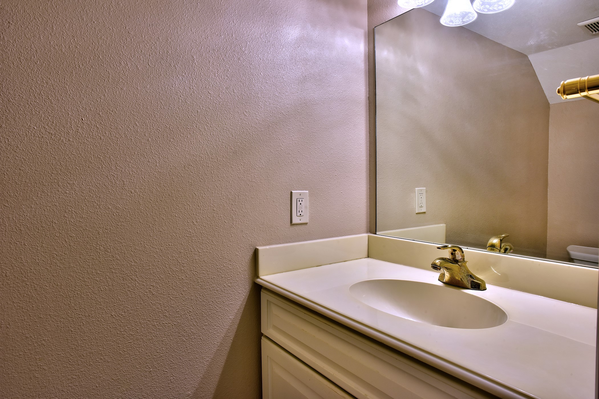 7441 Brompton Street Houston, TX 77025 - Photo 11 of 21 a bathroom with a sink and a mirror