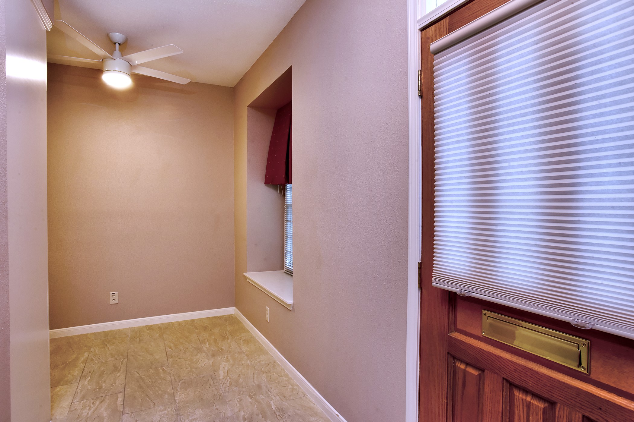 7441 Brompton Street Houston, TX 77025 - Photo 4 of 21 a view of an empty room with a window