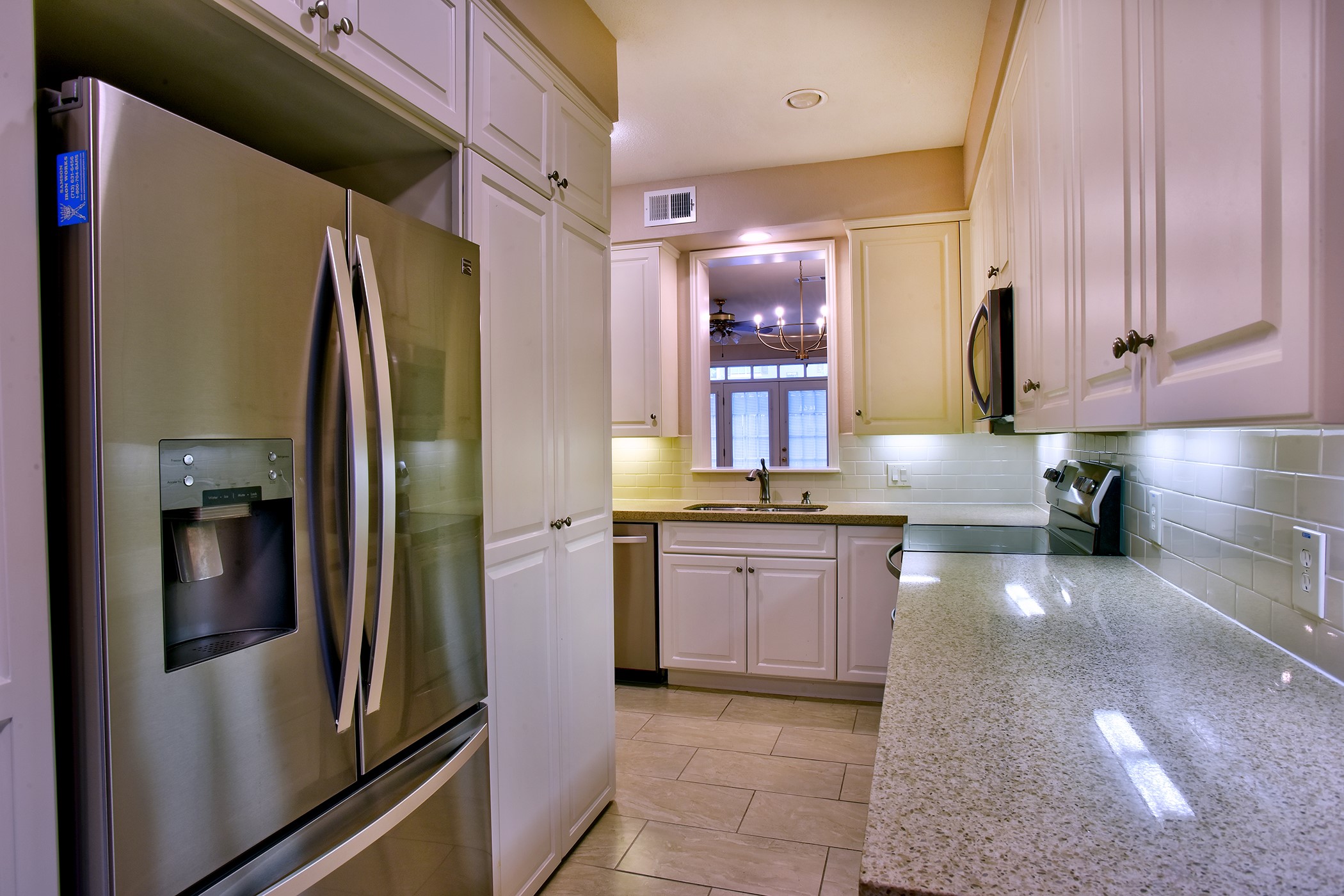 7441 Brompton Street Houston, TX 77025 - Photo 8 of 21 a kitchen with stainless steel appliances granite countertop a refrigerator and a sink