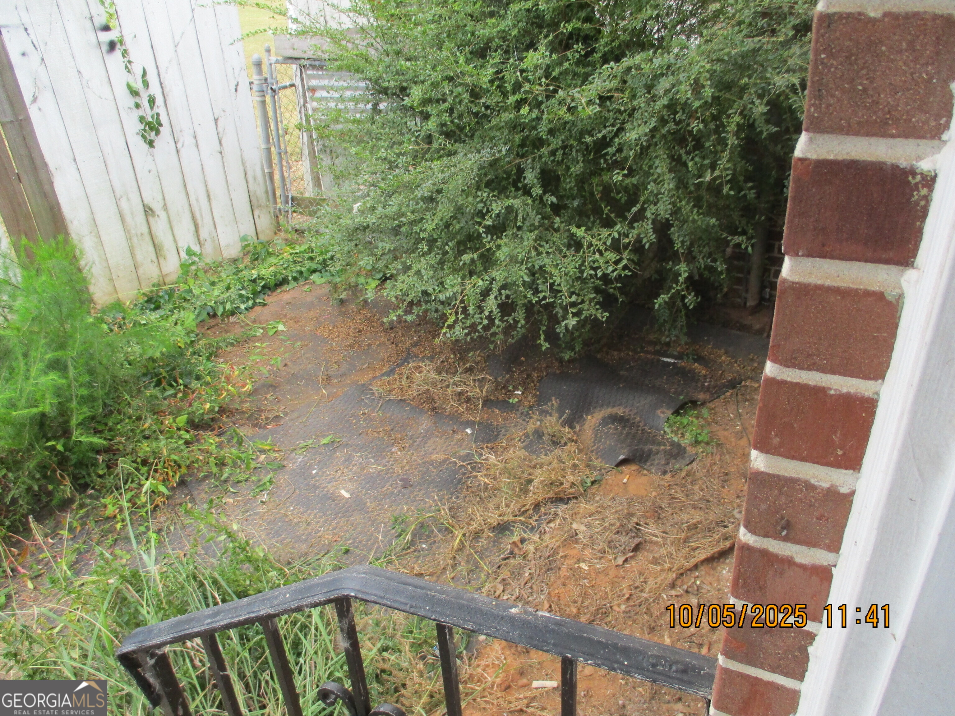 9182 Flat Shoals Road Southwest, Unit STREET Covington, GA 30014 - Photo 12 of 13 a view of a yard with plants