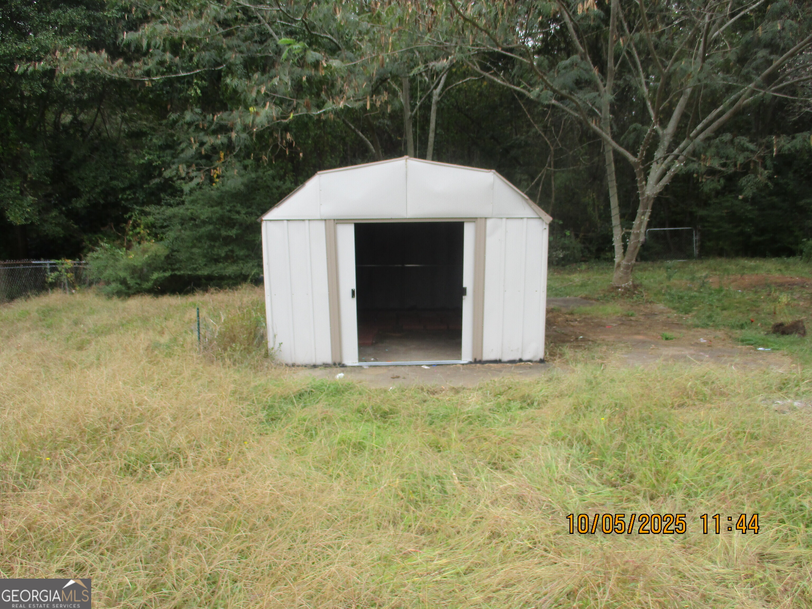 9182 Flat Shoals Road Southwest, Unit STREET Covington, GA 30014 - Photo 13 of 13 a aerial view of a house with a yard