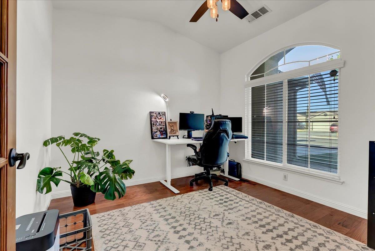 695 Crescent Lane Lemoore, CA 93245 - Photo 14 of 51 a view of a workspace with furniture and a potted plant