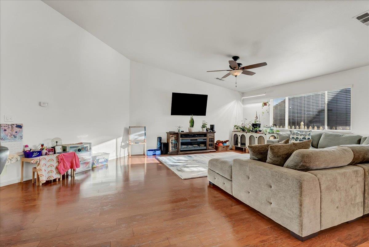 695 Crescent Lane Lemoore, CA 93245 - Photo 17 of 51 a living room with furniture and a flat screen tv