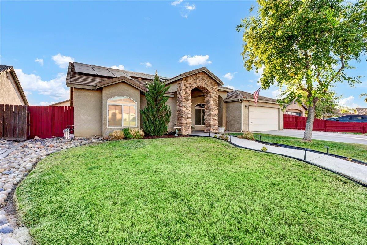 695 Crescent Lane Lemoore, CA 93245 - Photo 2 of 51 a front view of house with yard and green space