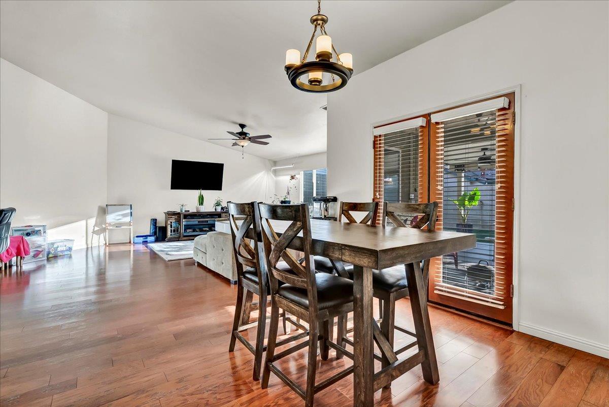 695 Crescent Lane Lemoore, CA 93245 - Photo 21 of 51 a view of a dining room with furniture window and wooden floor