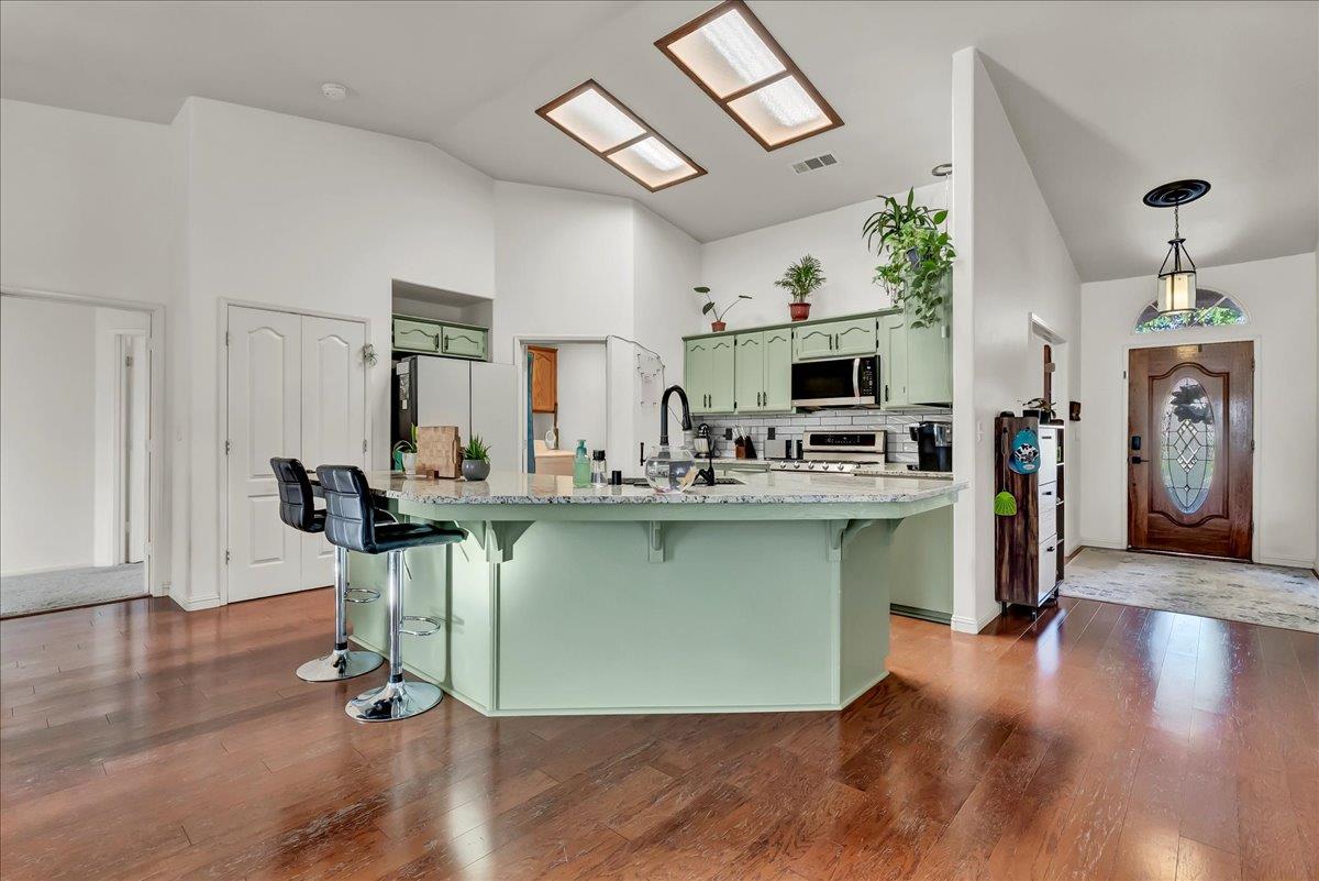 695 Crescent Lane Lemoore, CA 93245 - Photo 23 of 51 a living room with furniture a fireplace and wooden floor
