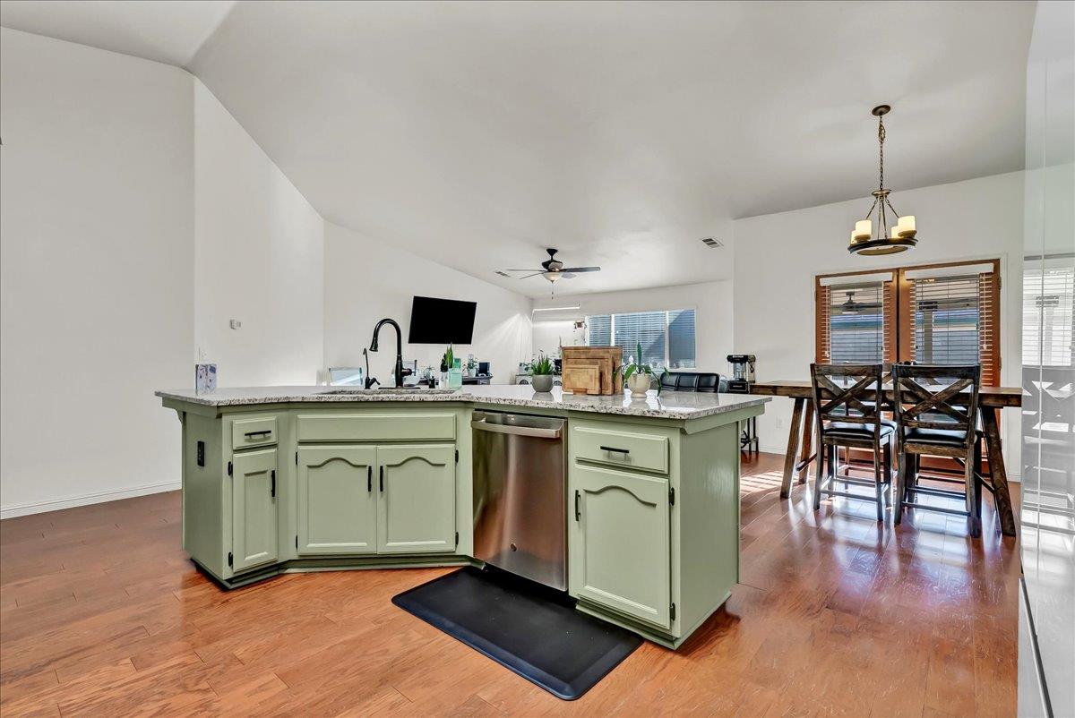 695 Crescent Lane Lemoore, CA 93245 - Photo 25 of 51 a kitchen with cabinets a sink and appliances