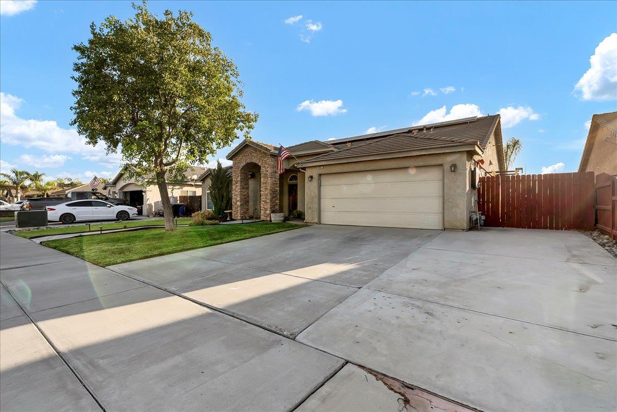 695 Crescent Lane Lemoore, CA 93245 - Photo 3 of 51 a view of a parking space in a house