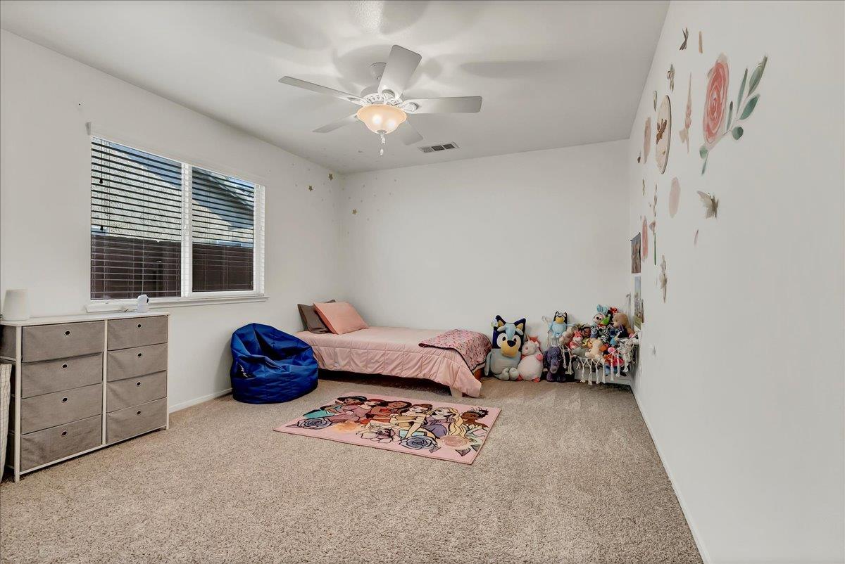 695 Crescent Lane Lemoore, CA 93245 - Photo 34 of 51 a bedroom with furniture and a window