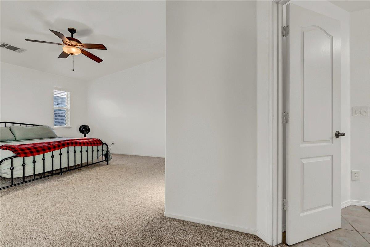 695 Crescent Lane Lemoore, CA 93245 - Photo 36 of 51 a living room with a couch and a chandelier