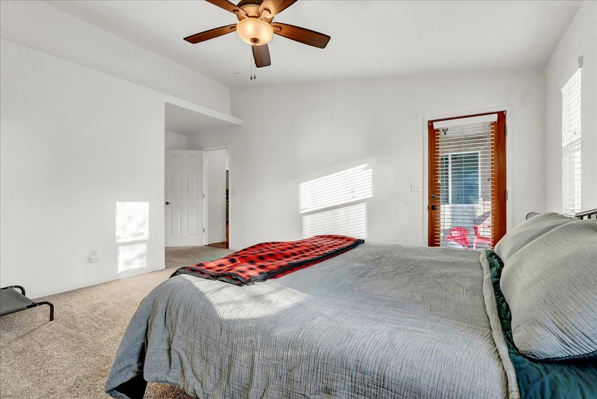 695 Crescent Lane Lemoore, CA 93245 - Photo 38 of 51 a bedroom with a bed and a chandelier