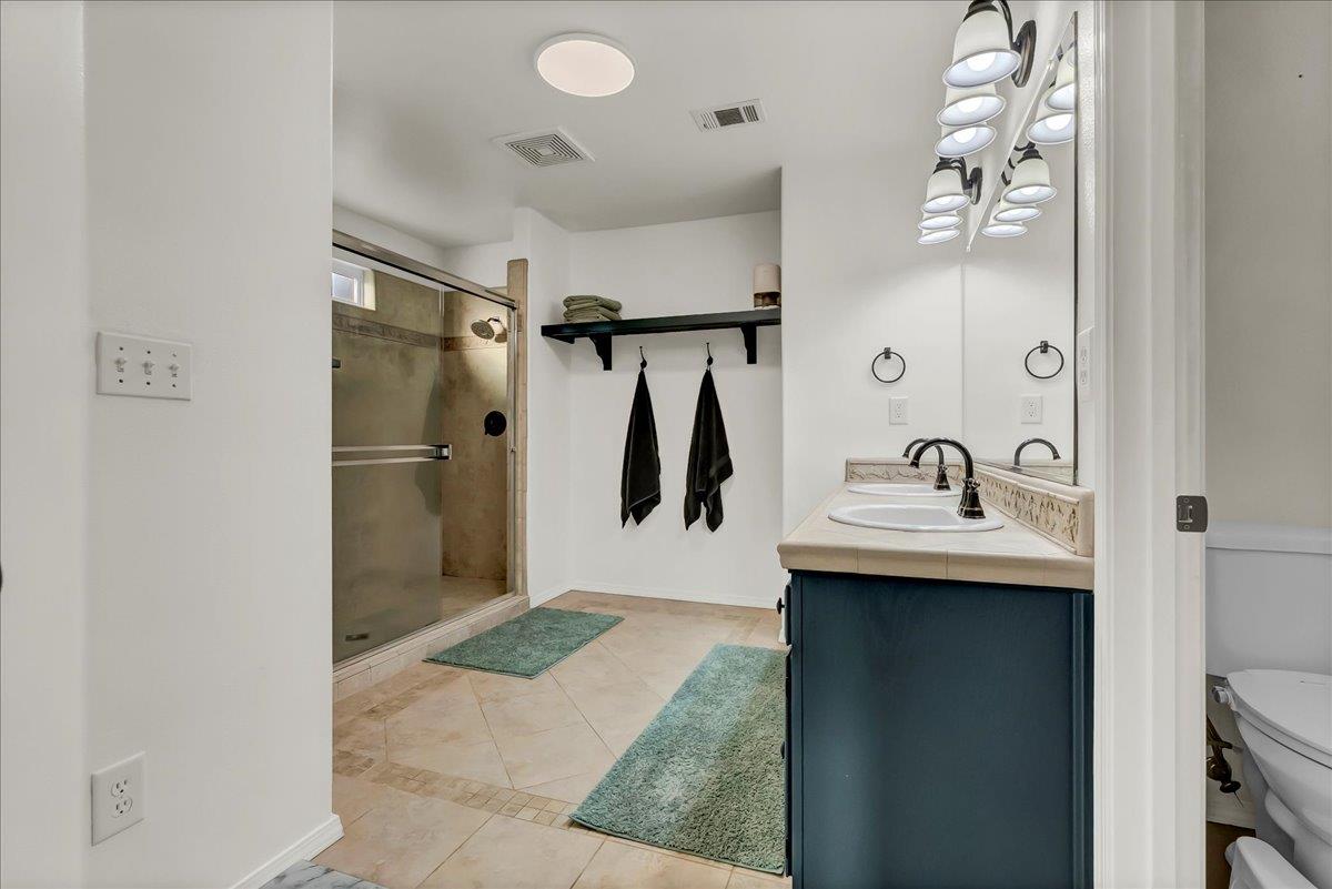 695 Crescent Lane Lemoore, CA 93245 - Photo 39 of 51 a bathroom with a sink and mirror