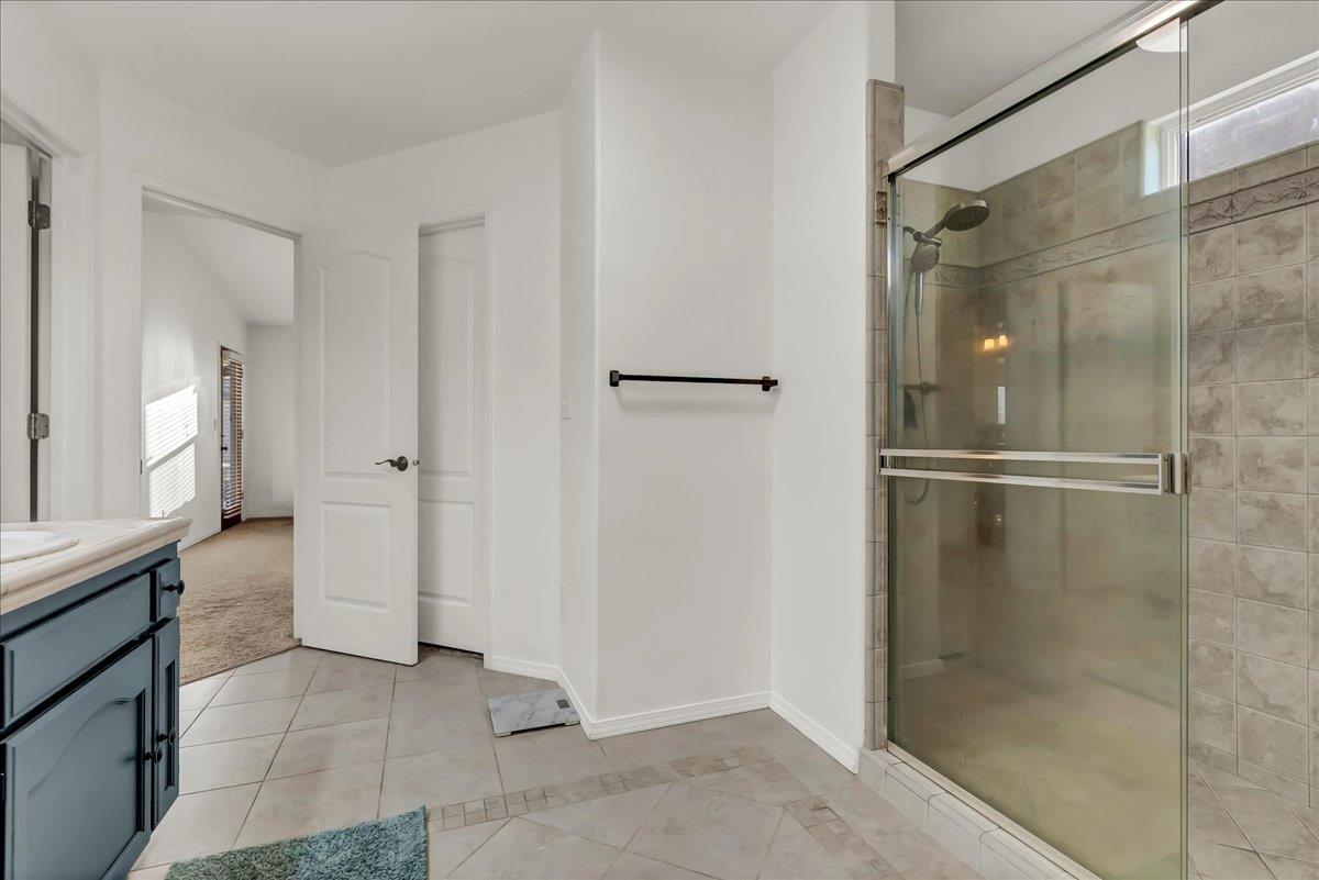 695 Crescent Lane Lemoore, CA 93245 - Photo 40 of 51 a bathroom with a shower and a glass door