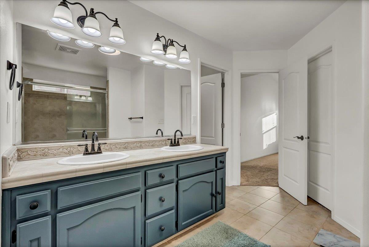 695 Crescent Lane Lemoore, CA 93245 - Photo 41 of 51 a bathroom with a sink double vanity and a mirror