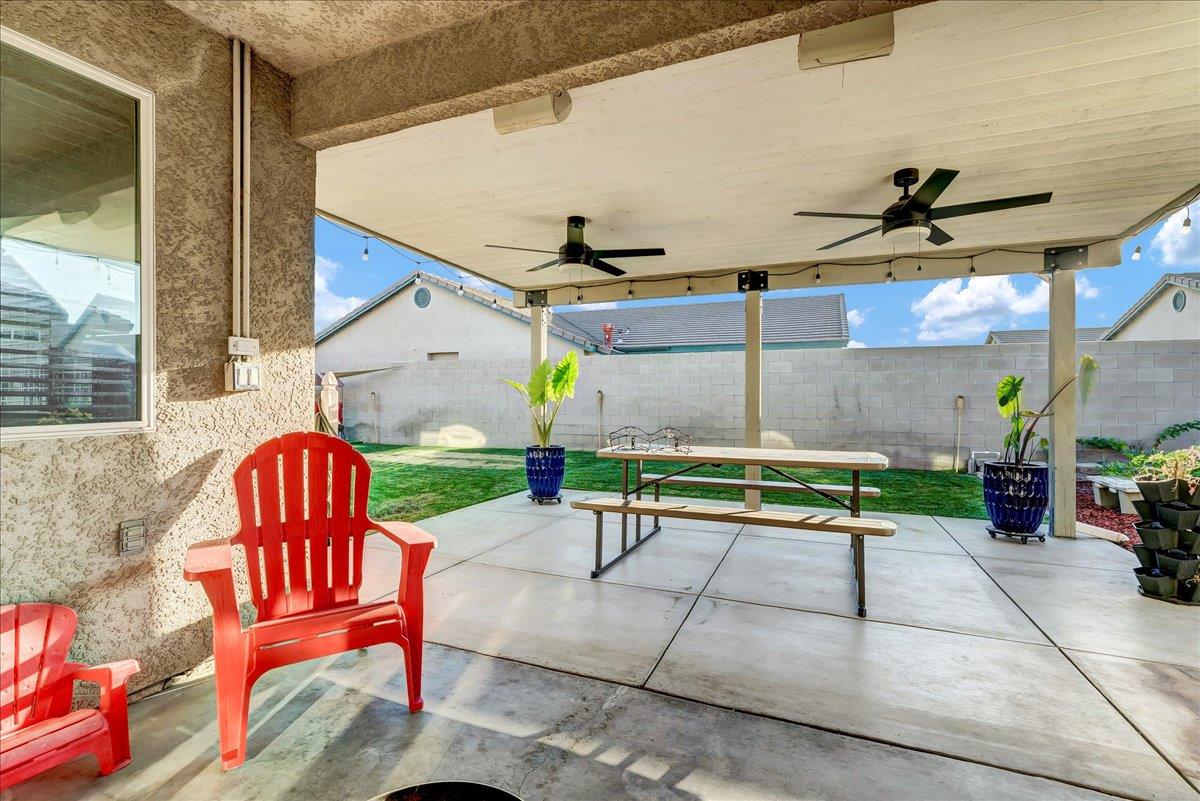 695 Crescent Lane Lemoore, CA 93245 - Photo 42 of 51 a view of a chairs and table in the patio