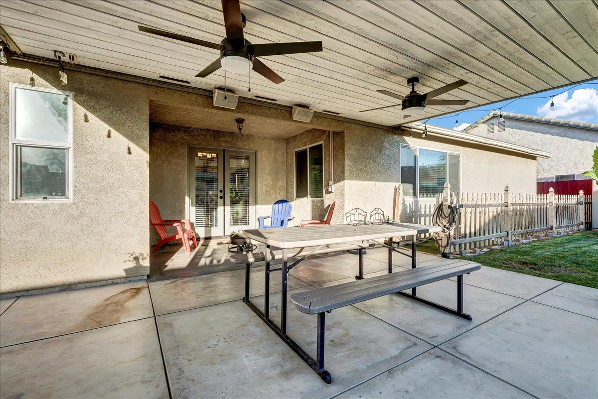 695 Crescent Lane Lemoore, CA 93245 - Photo 43 of 51 a view of a patio with table and chairs