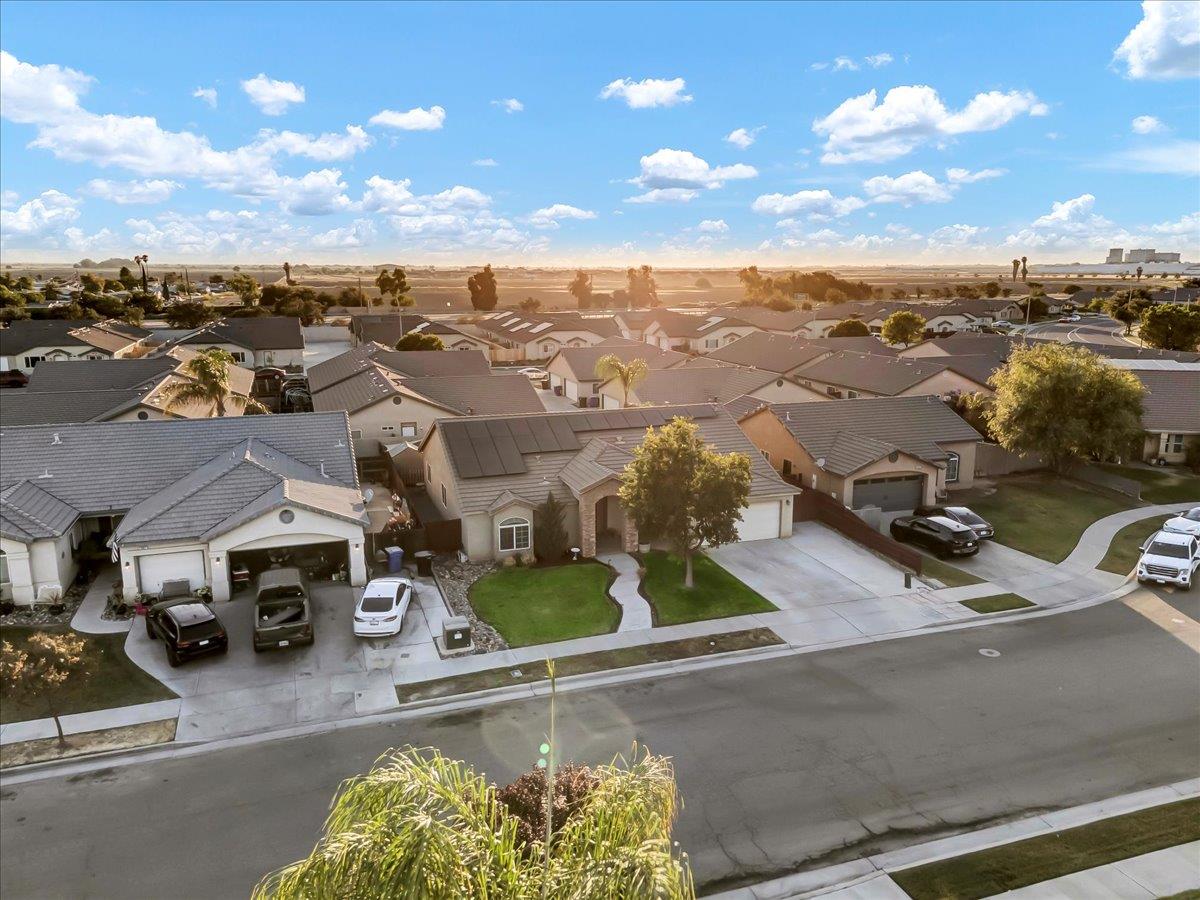 695 Crescent Lane Lemoore, CA 93245 - Photo 5 of 51 an aerial view of residential houses with outdoor space