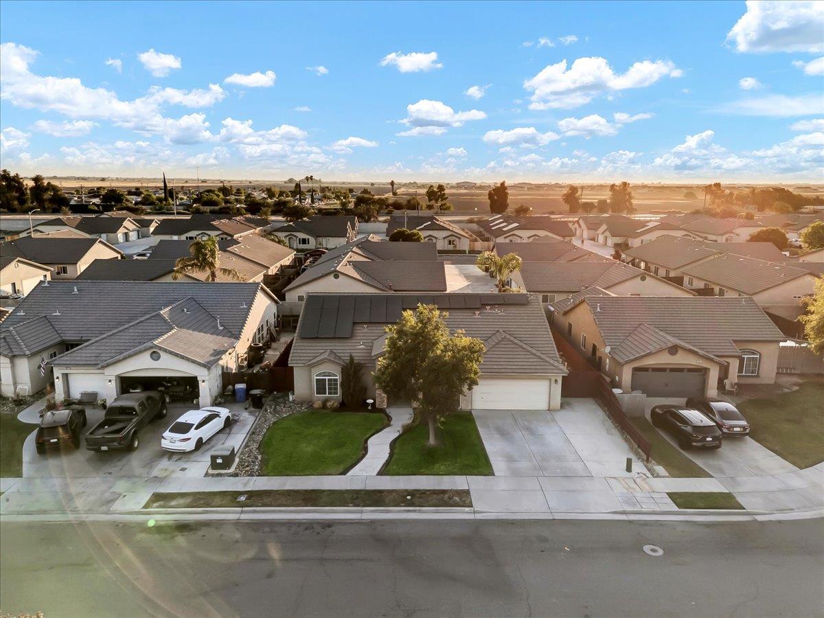 695 Crescent Lane Lemoore, CA 93245 - Photo 6 of 51 an aerial view of a house with a garden