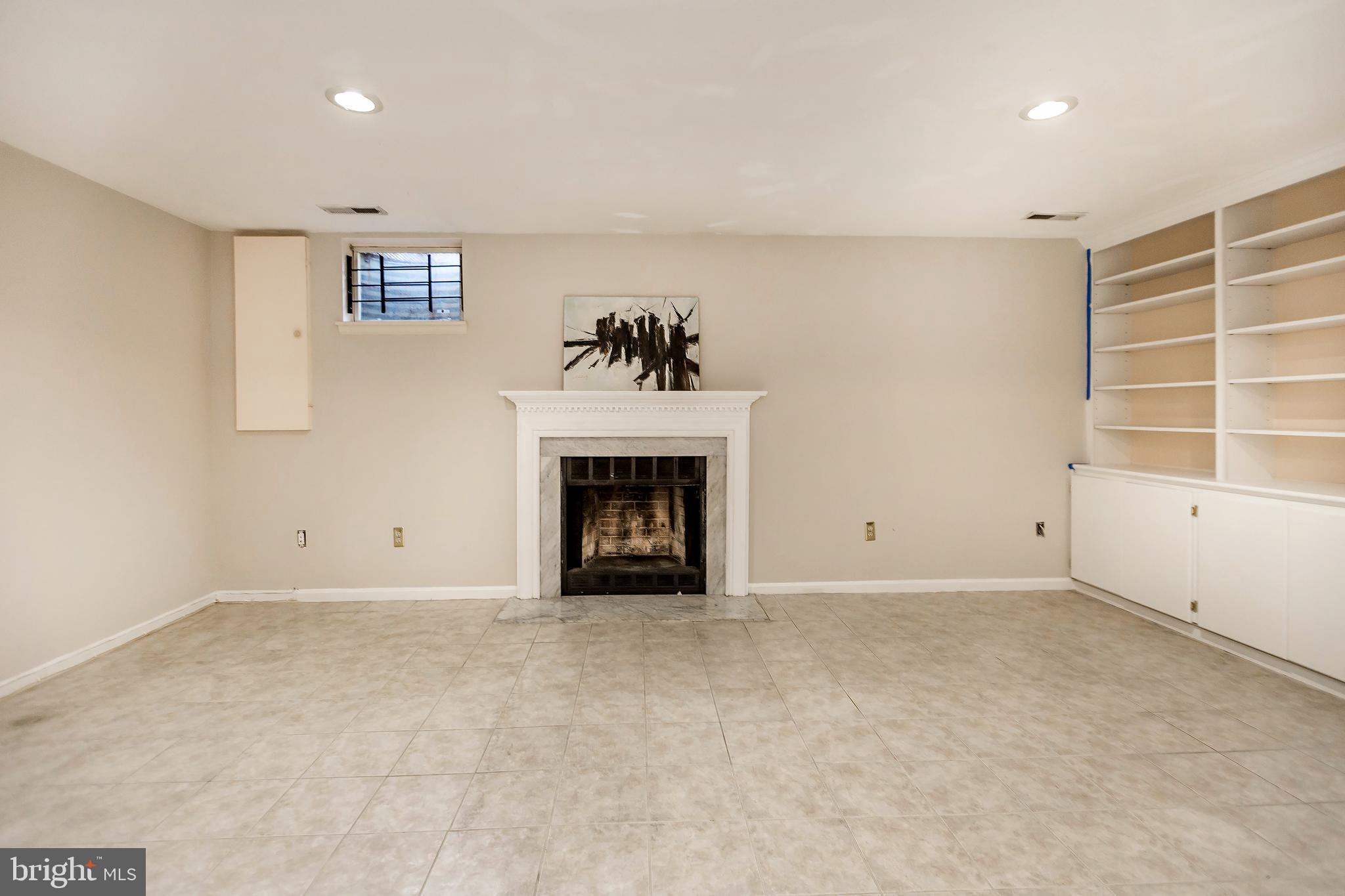 15128 Callohan Court Silver Spring, MD 20906 - Photo 28 of 37 Basement with wood burning FP