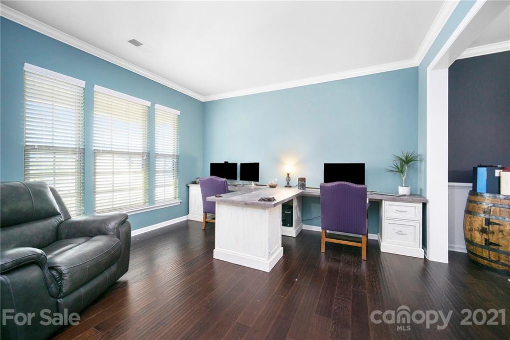 2159 Stone Pile Drive Concord, NC 28025 - Photo 17 of 33 a living room with furniture a wooden floor and a large window