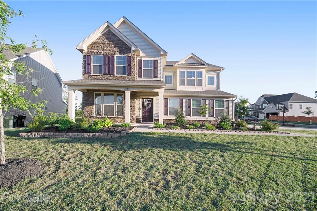 2159 Stone Pile Drive Concord, NC 28025 - Photo 2 of 33 a front view of a house with a yard
