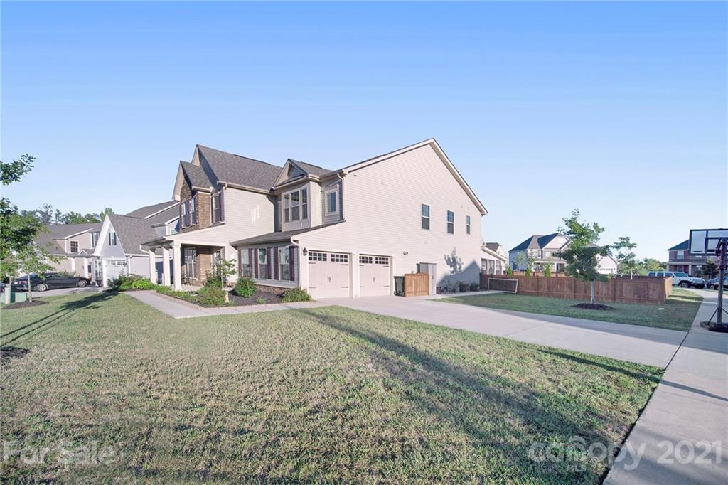 2159 Stone Pile Drive Concord, NC 28025 - Photo 3 of 33 a front view of a house with a yard
