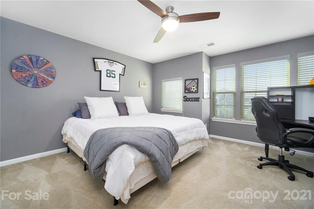 2159 Stone Pile Drive Concord, NC 28025 - Photo 26 of 33 a bedroom with a bed and chair