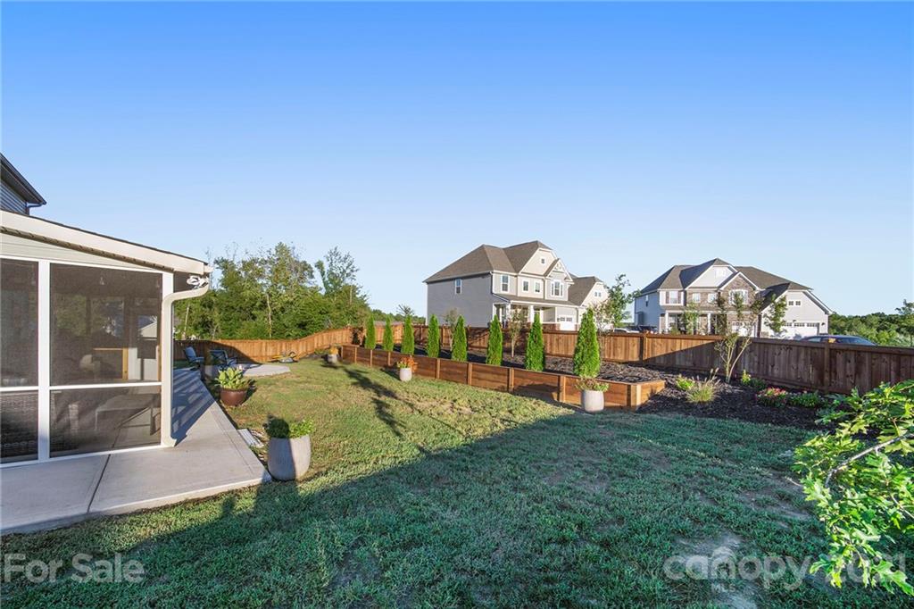2159 Stone Pile Drive Concord, NC 28025 - Photo 31 of 33 a view of a house with a big yard and potted plants