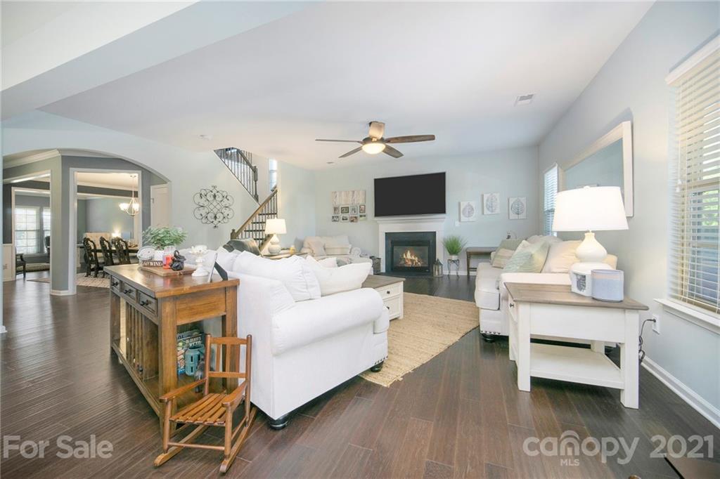 2159 Stone Pile Drive Concord, NC 28025 - Photo 9 of 33 a living room with furniture and a wooden floor
