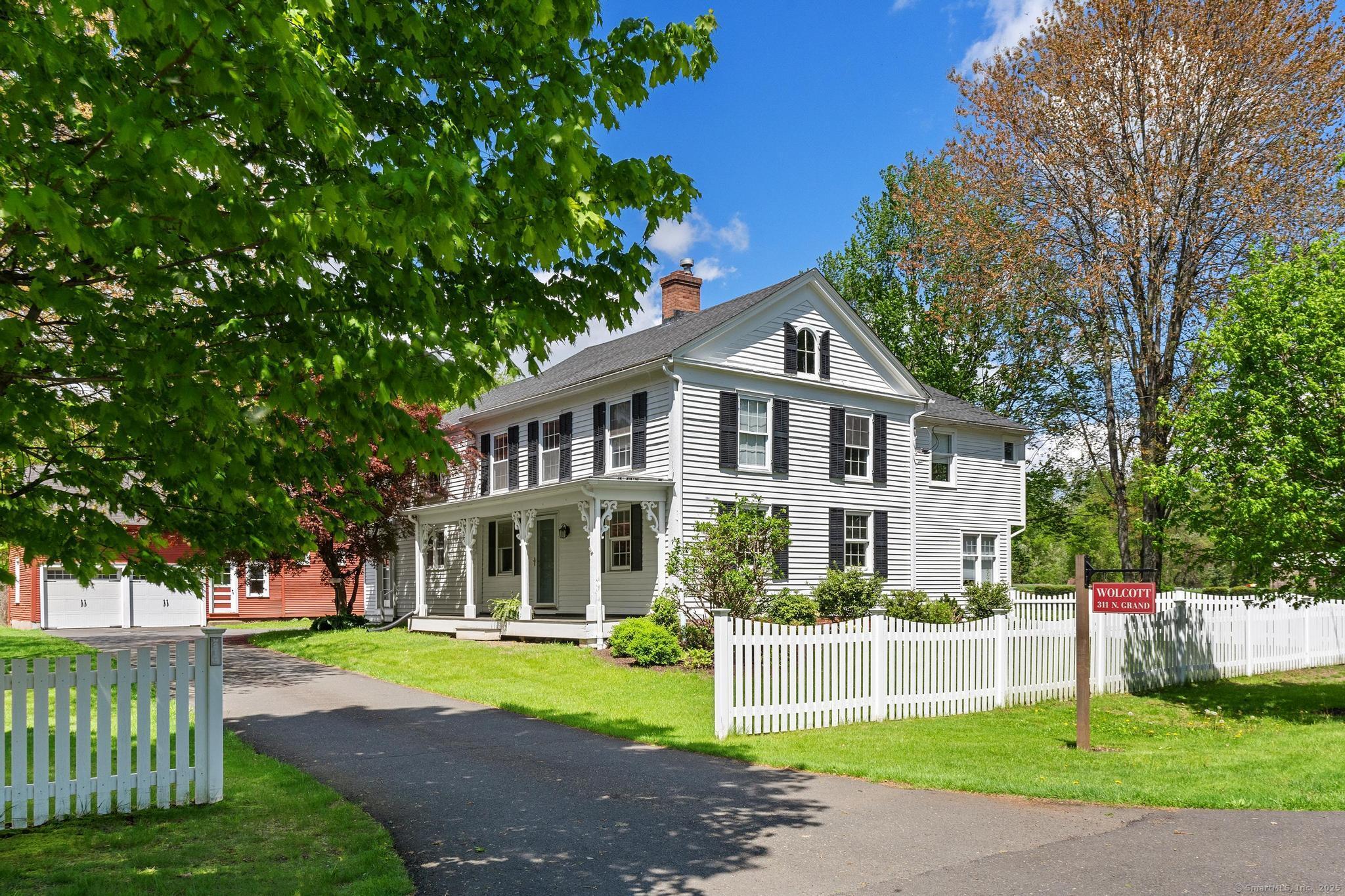 309 North Grand Street Suffield, CT 06093 - Photo 1 of 1 a front view of a house with a yard