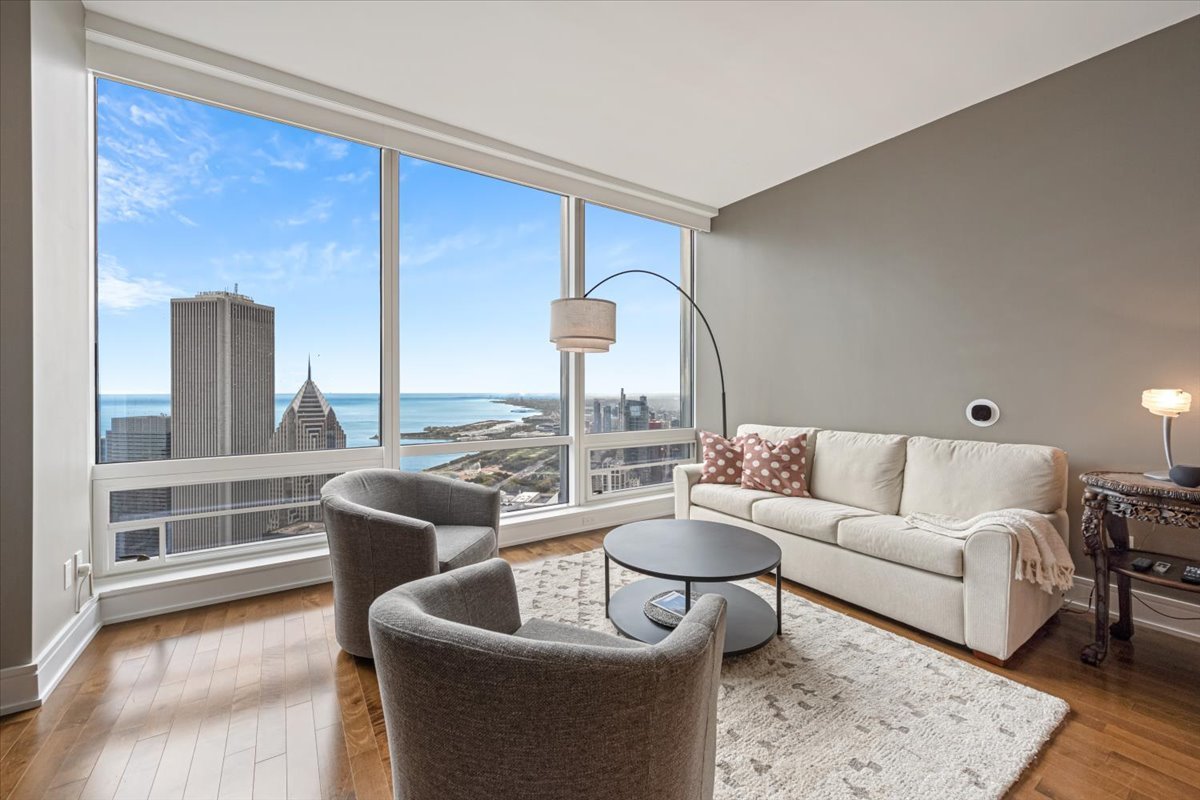 401 North Wabash Avenue, Unit 69F Chicago, IL 60611 - Photo 3 of 35 a living room with furniture and a large window