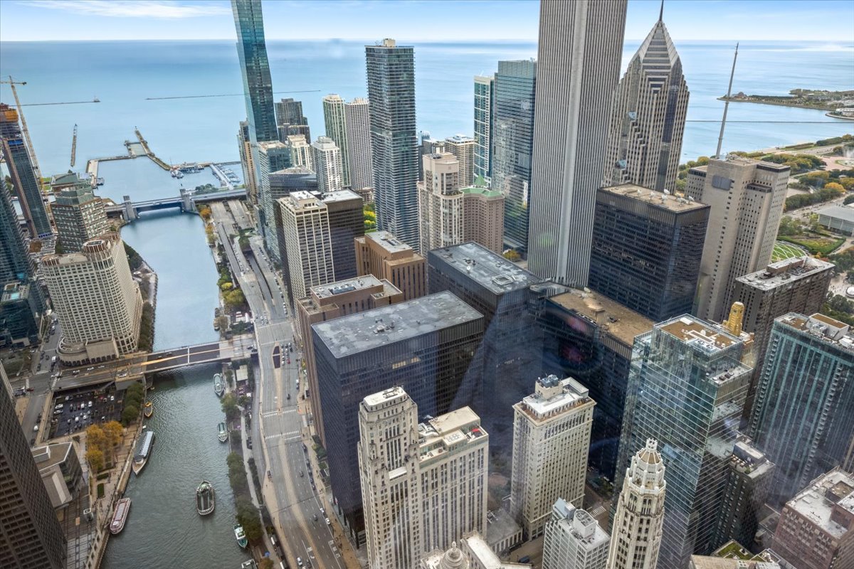 401 North Wabash Avenue, Unit 69F Chicago, IL 60611 - Photo 4 of 35 a bed room with a bed and a table