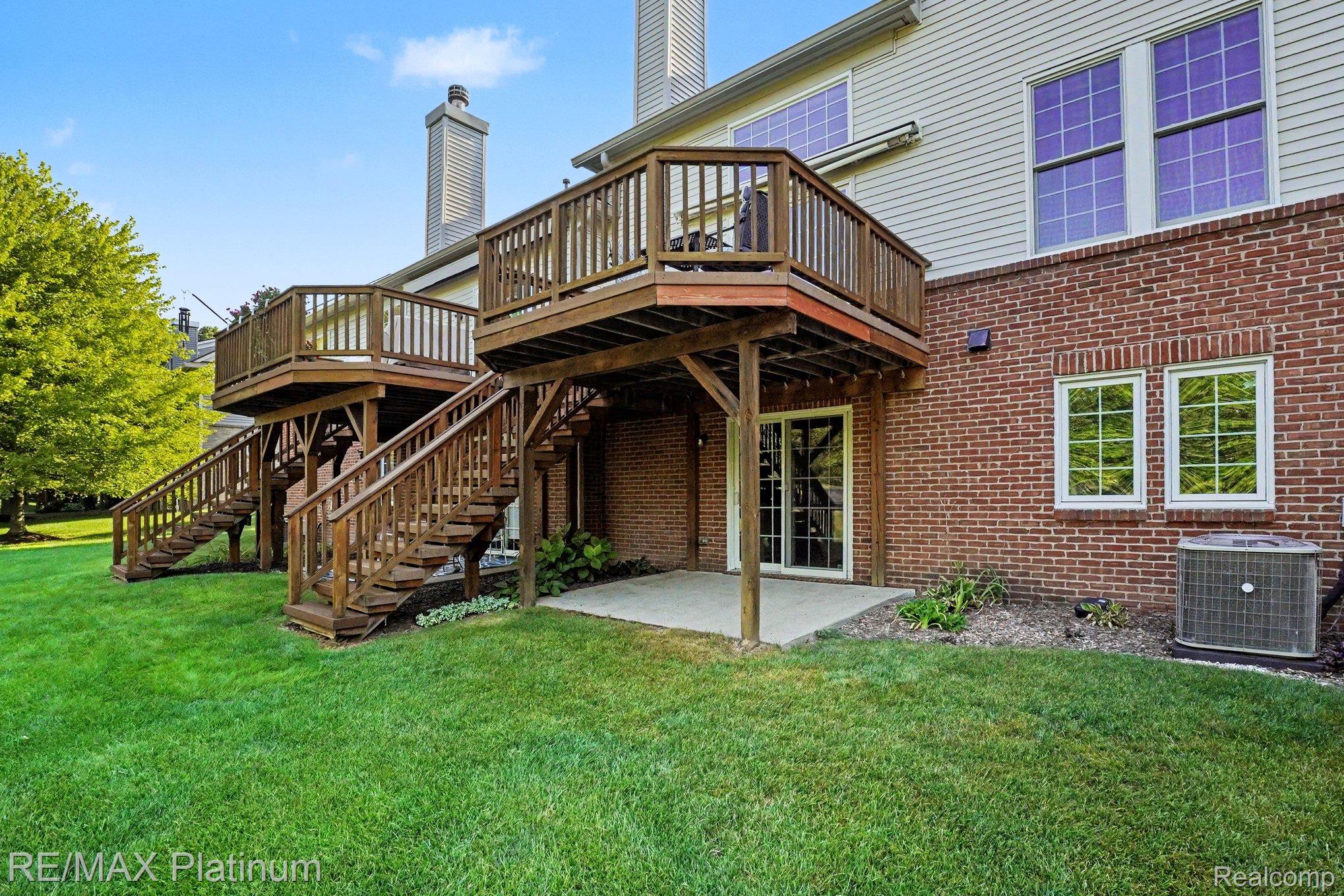 609 Telya Ridge Milford, MI 48381 - Photo 28 of 28 Dual-level wood-finish decks with integrated stairs, providing outdoor access from upper and lower floors