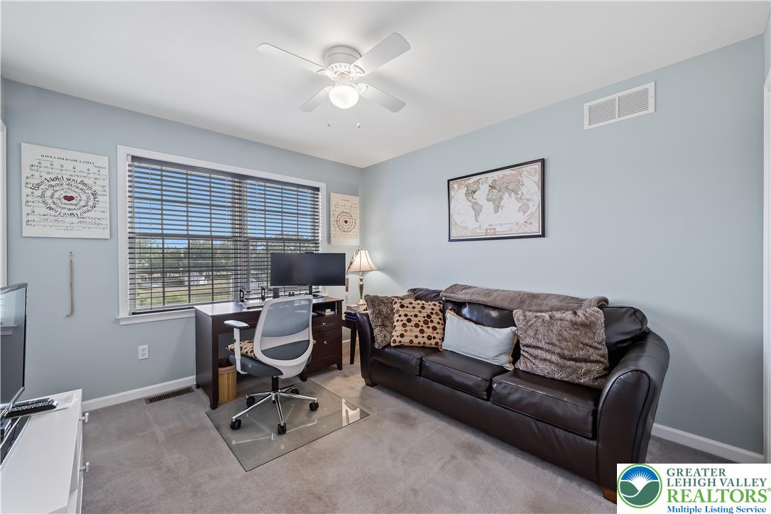 13 Country Road Northampton, PA 18067 - Photo 44 of 71 A well-appointed office space offers ample natural light and plush carpeting, perfect for productivity or relaxation.