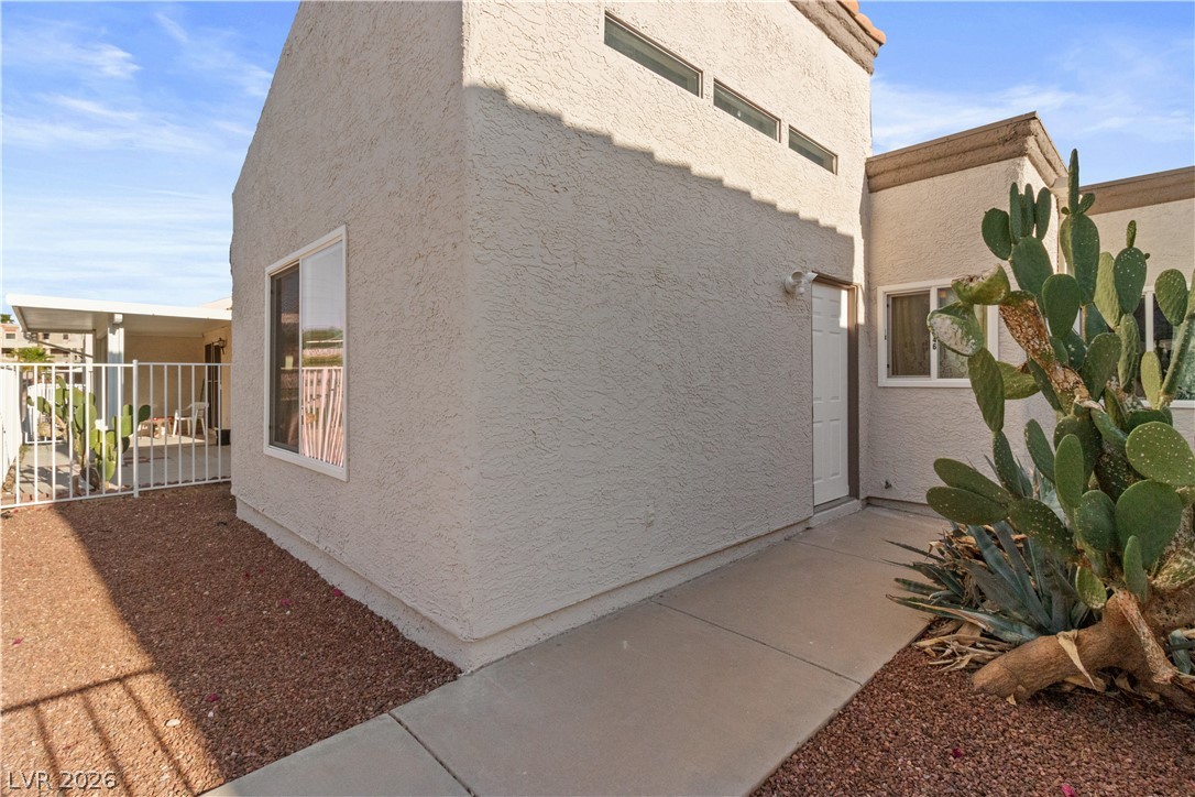 2146 High Dunes Lane Laughlin, NV 89029 - Photo 41 of 64 View of side of home featuring stucco siding