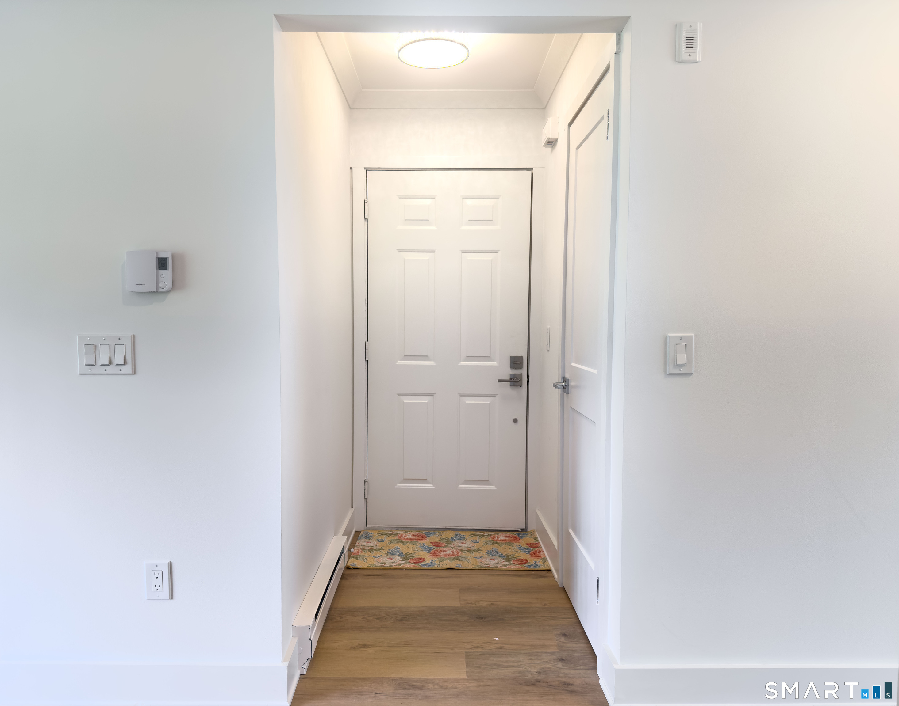 63 Glen Ridge Court, Unit 63 New Milford, CT 06776 - Photo 11 of 15 a view of a hallway