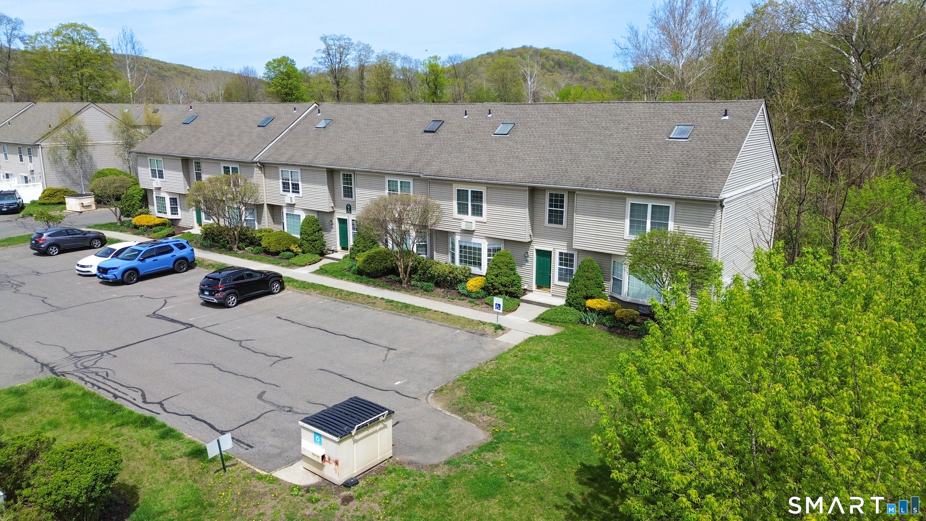 63 Glen Ridge Court, Unit 63 New Milford, CT 06776 - Photo 15 of 15 an aerial view of a house with garden space and street view