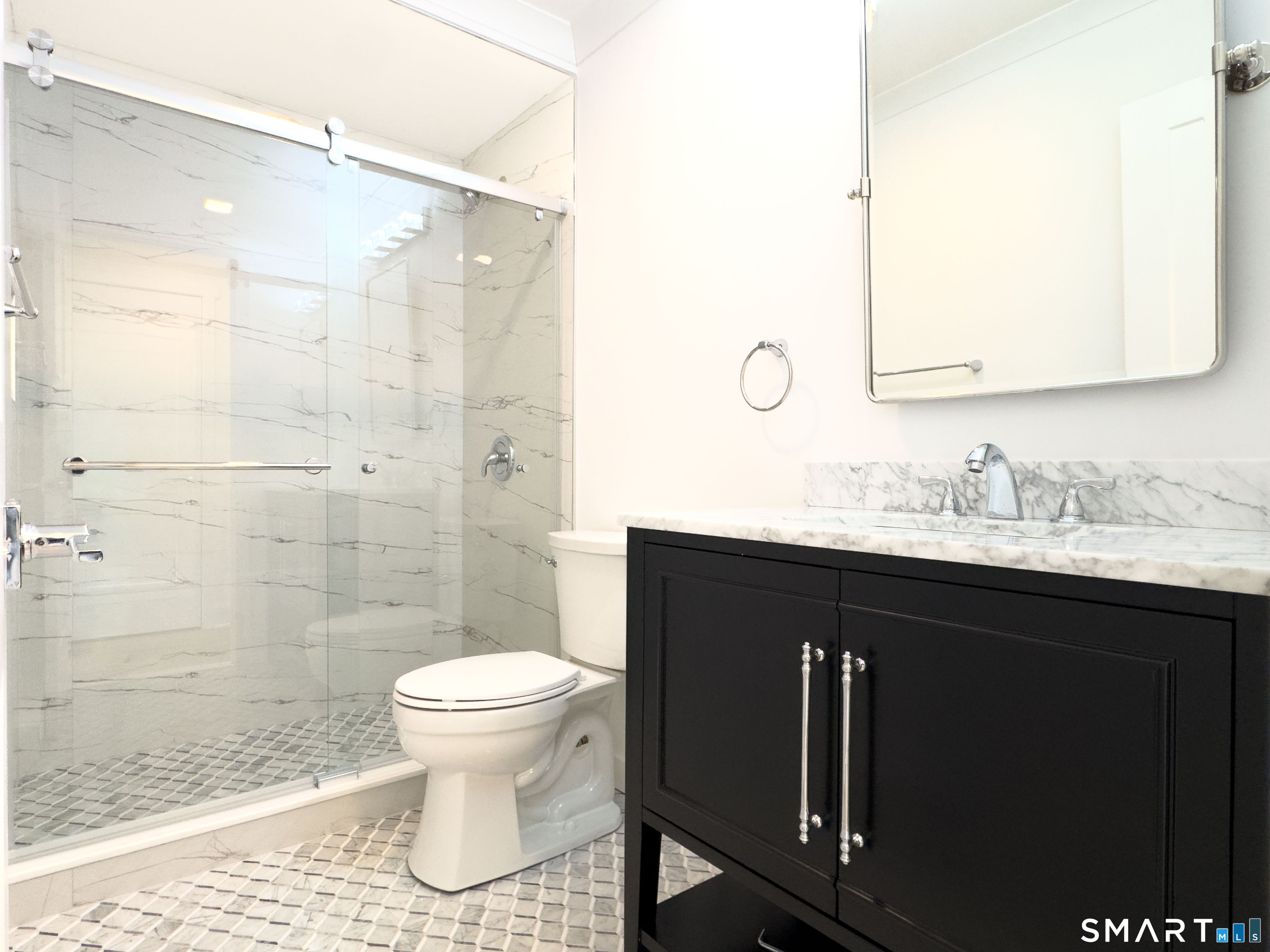 63 Glen Ridge Court, Unit 63 New Milford, CT 06776 - Photo 7 of 15 a bathroom with a sink toilet and shower