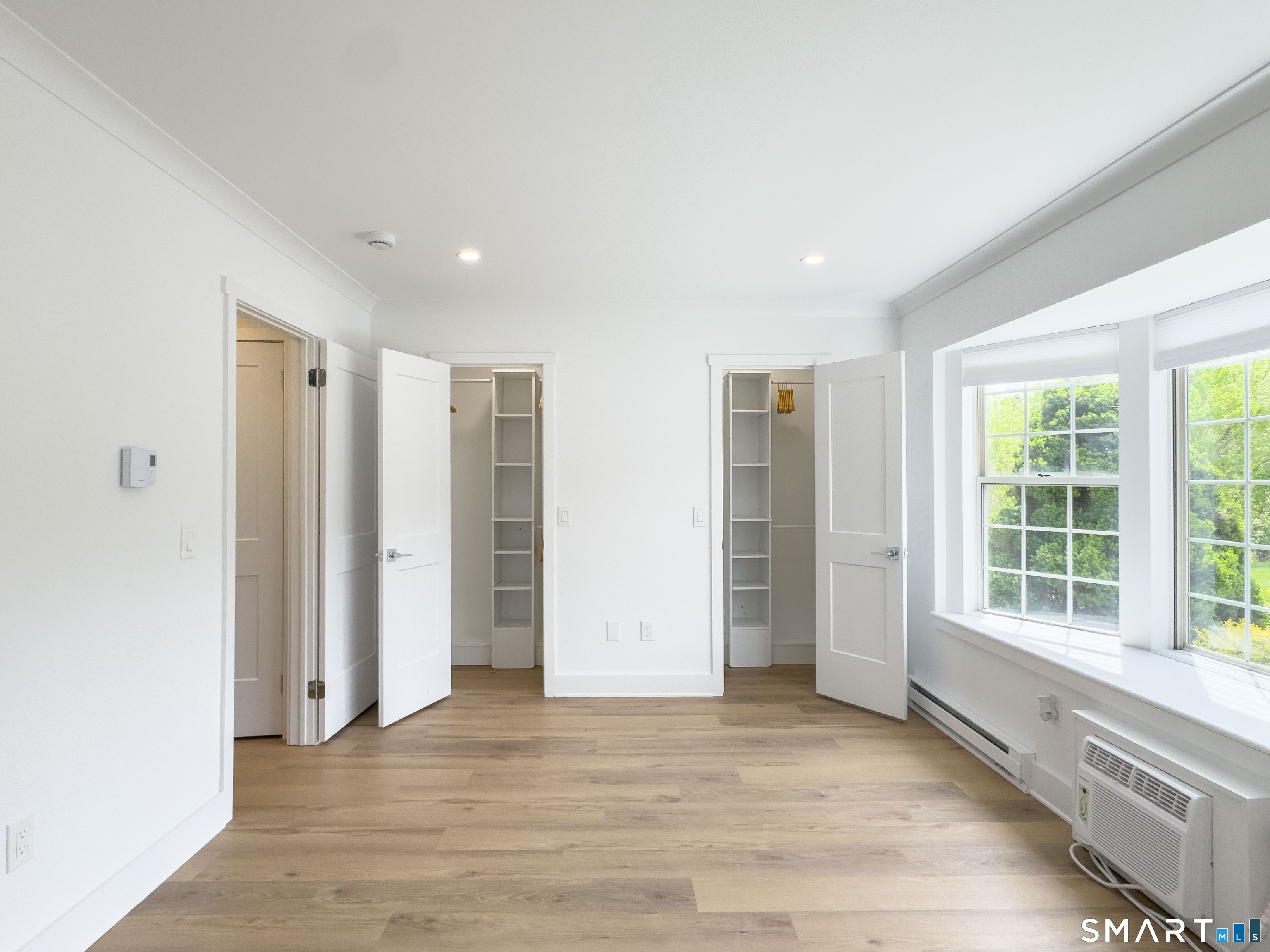 63 Glen Ridge Court, Unit 63 New Milford, CT 06776 - Photo 9 of 15 a view of an empty room with a window