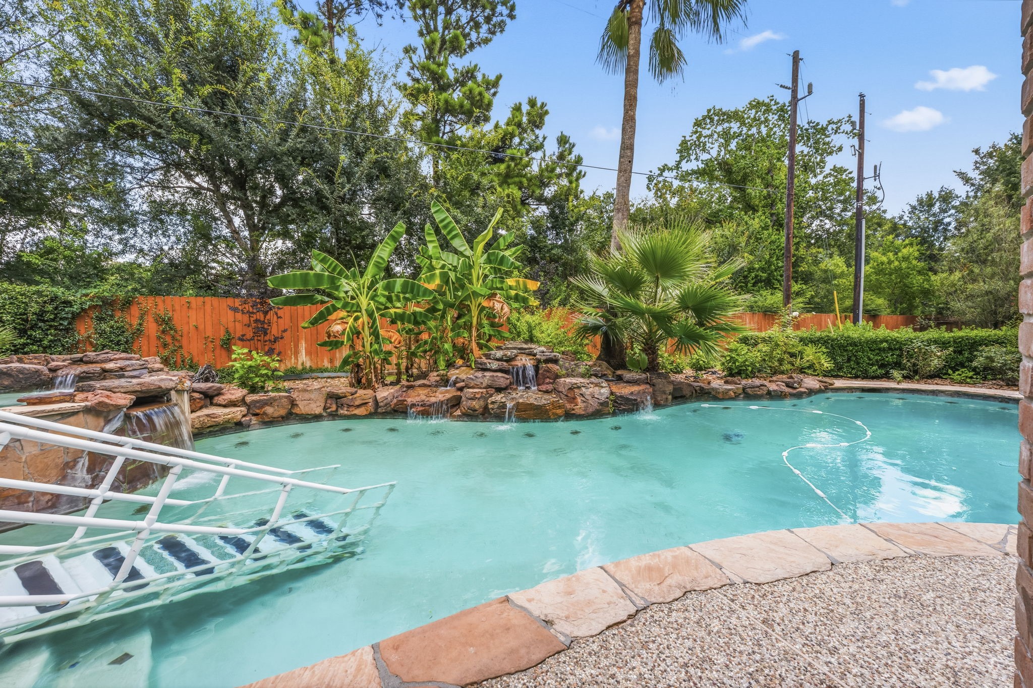 18503 Cabaniss Circle Spring, TX 77379 - Photo 35 of 49 Multiple cascading waterfalls, natural stone accents, and tropical landscaping create a peaceful resort-style setting with no rear neighbors overlooking you.