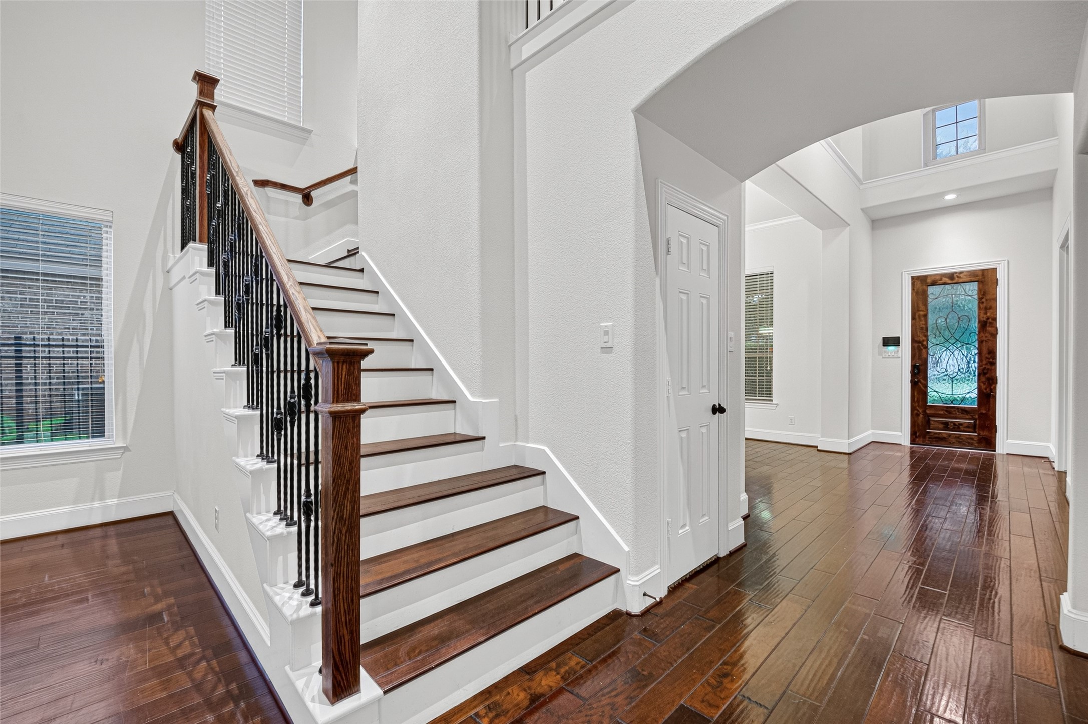 7930 Summer Night Lane Rosenberg, TX 77469 - Photo 28 of 48 Open staircase and upstairs landing overlooking the main living area, enhancing the home's spacious design.