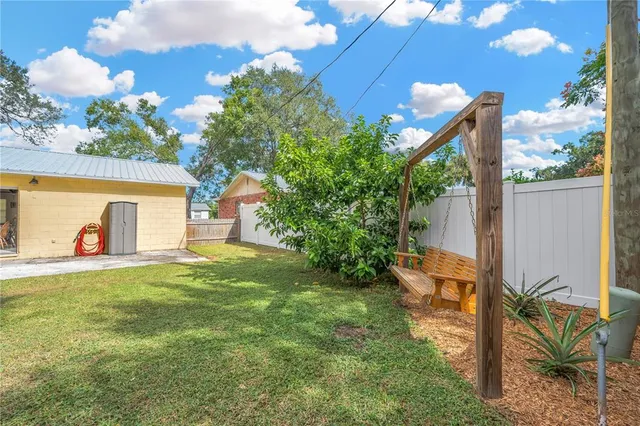 a view of a backyard with a garden and plants