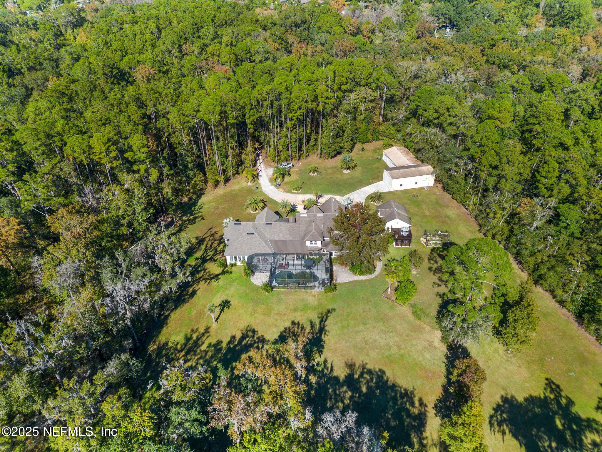 3010 Starratt Road Jacksonville, FL 32226 - Photo 11 of 106 an aerial view of a house with a yard swimming pool outdoor seating and yard