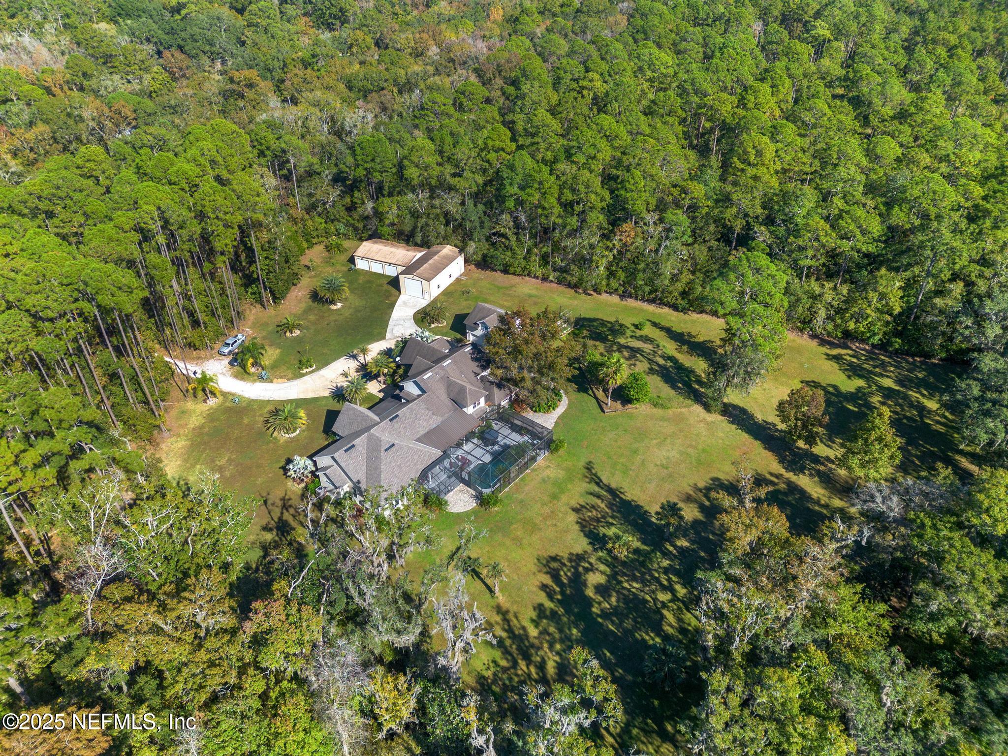 3010 Starratt Road Jacksonville, FL 32226 - Photo 12 of 106 an aerial view of a house with a yard and lake view
