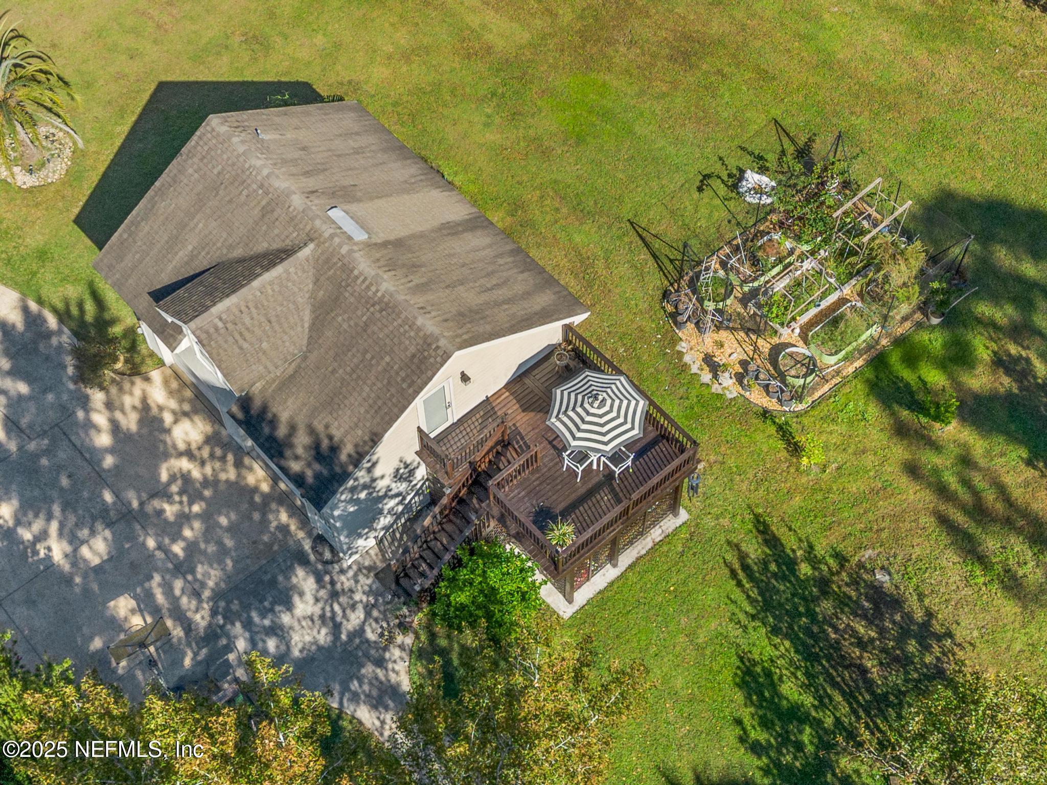 3010 Starratt Road Jacksonville, FL 32226 - Photo 15 of 106 a view of a wooden bench sitting in the middle of a yard
