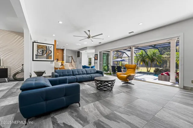 a spacious bathroom with a granite countertop sink a toilet a mirror and shower