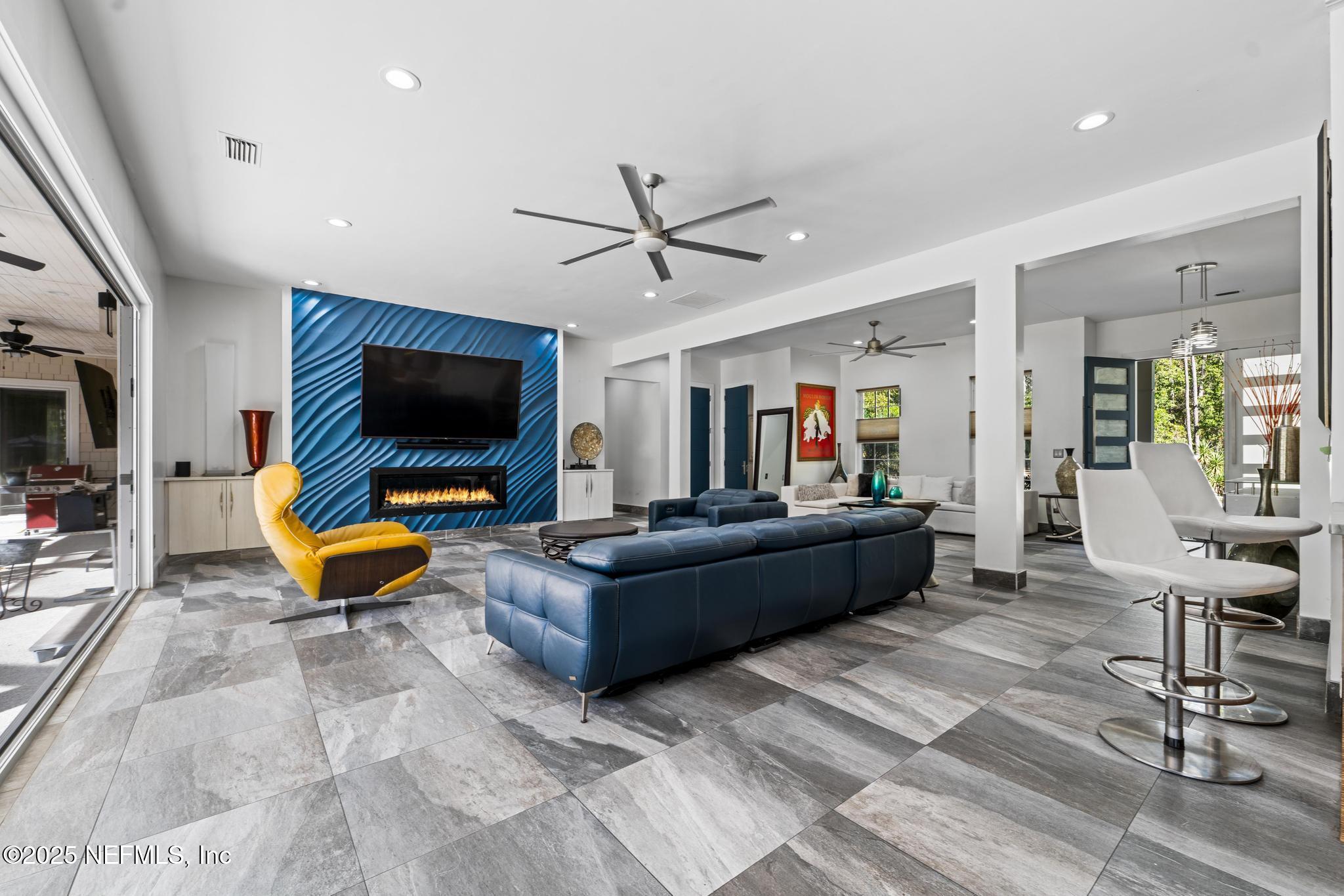 3010 Starratt Road Jacksonville, FL 32226 - Photo 26 of 106 a living room with furniture and a flat screen tv