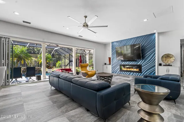 a kitchen with stainless steel appliances kitchen island granite countertop a refrigerator and a stove top oven