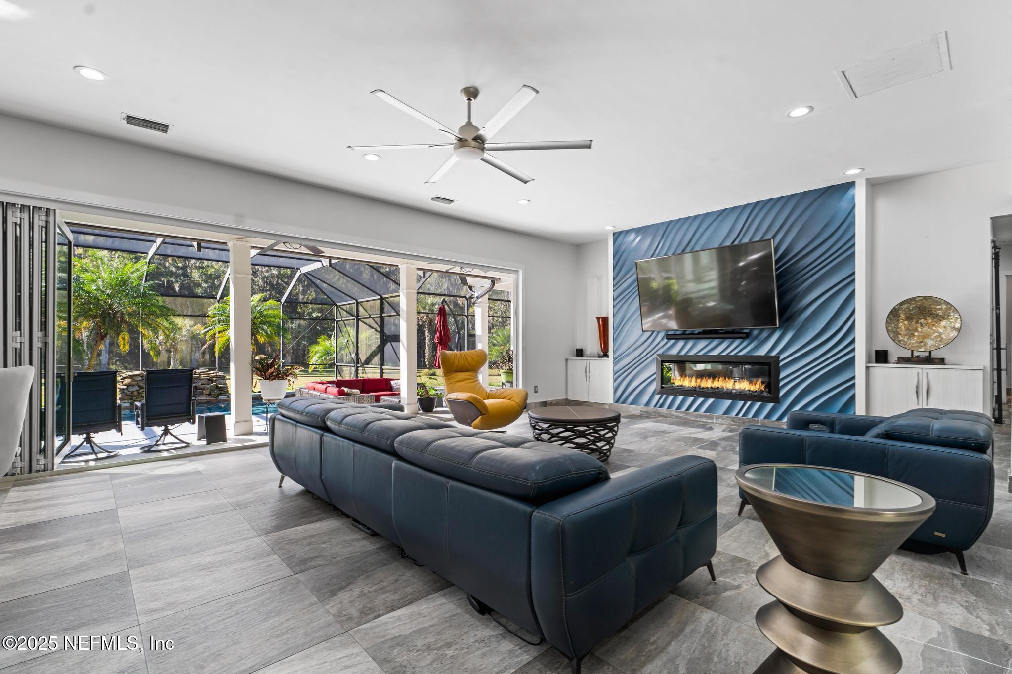 3010 Starratt Road Jacksonville, FL 32226 - Photo 28 of 106 a living room with furniture and a flat screen tv